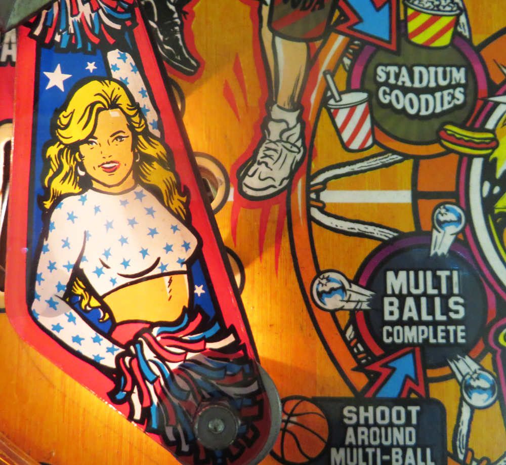 From NBA Fastbreak, my other favorite pinball machine. Shoot baskets behind the backglass, pass back and forth - it's a clever one. And there's just a little dash of T, minus the A, down by the flippers.