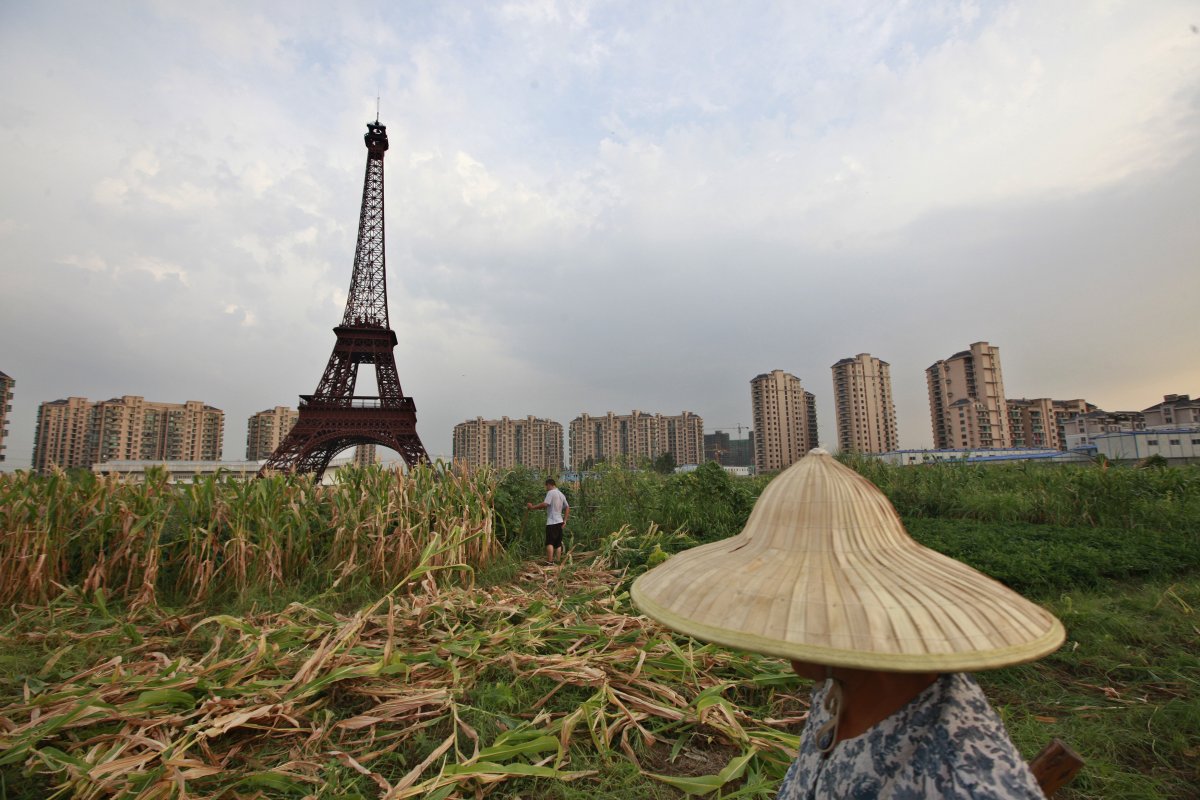 The Tianducheng Eiffel Tower soars over its unlikely surroundings.