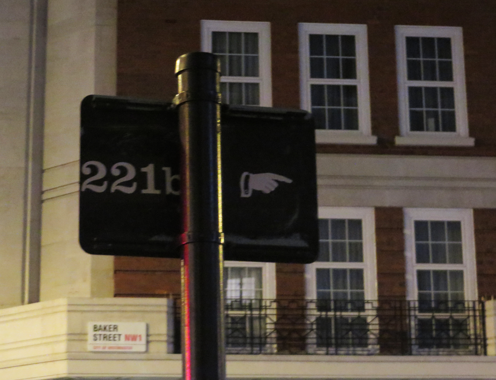 221b Baker Street sticker on the back of a street sign