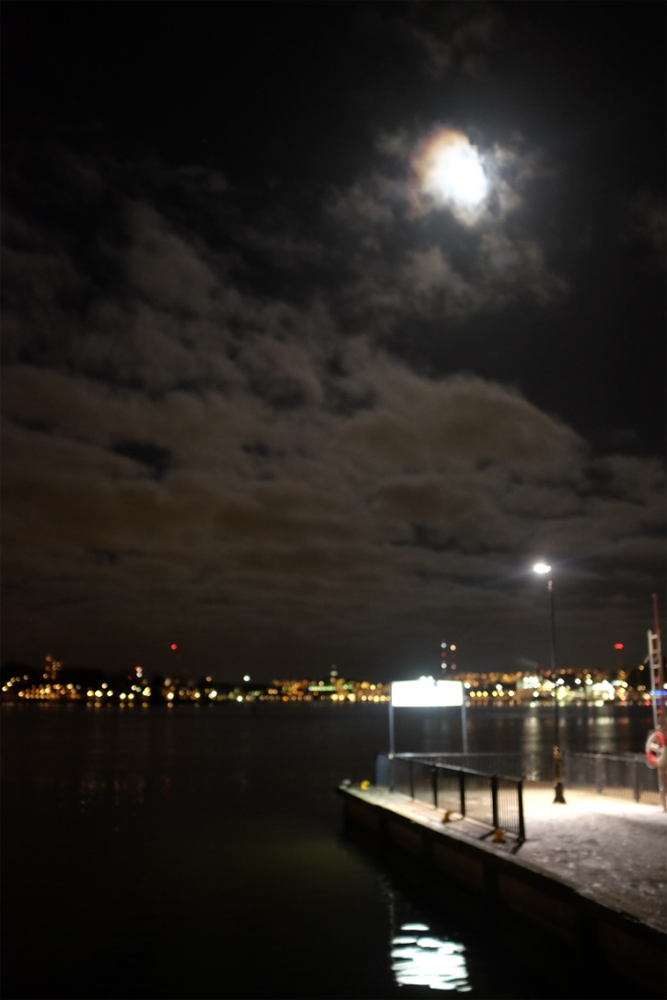 The moon over Sodermalm and Stockholm Harbor