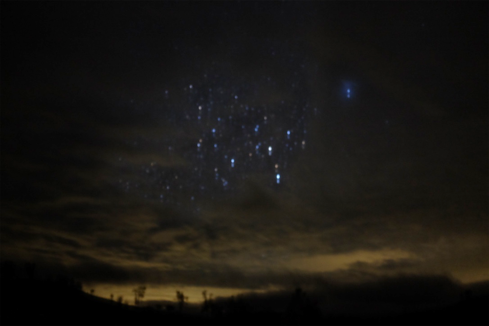Long-exposure photo of stars and the horizon in Santa Margarita, CA