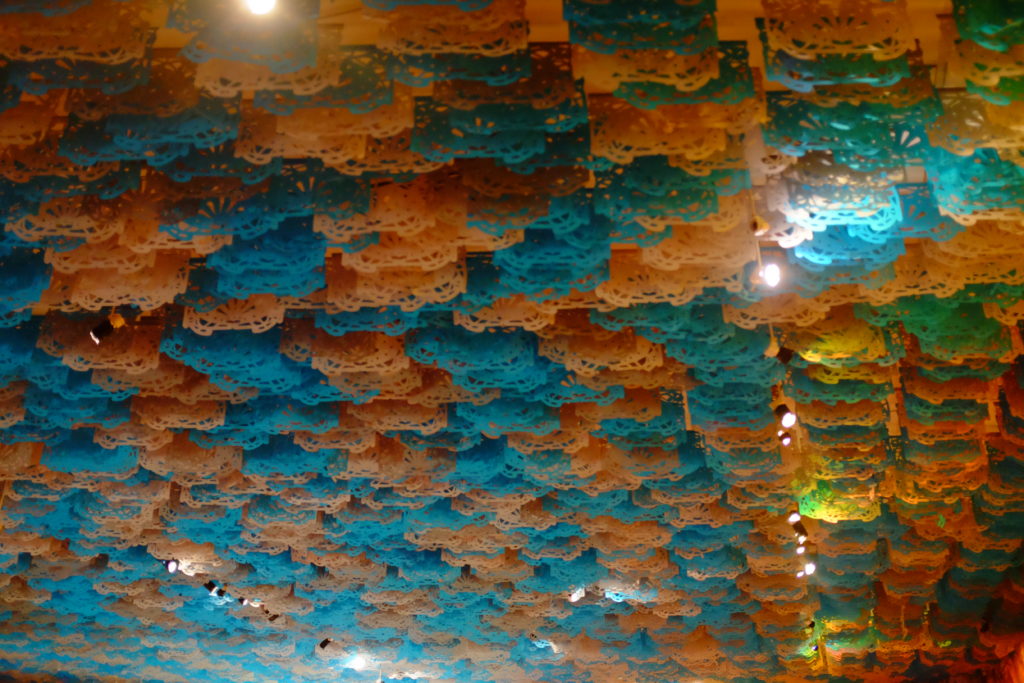 Orange and blue die-cut banners covering the ceiling