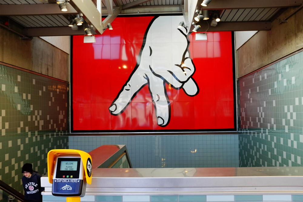 Mural of fingers walking on the wall at the Capitol Hill Light Rail Station