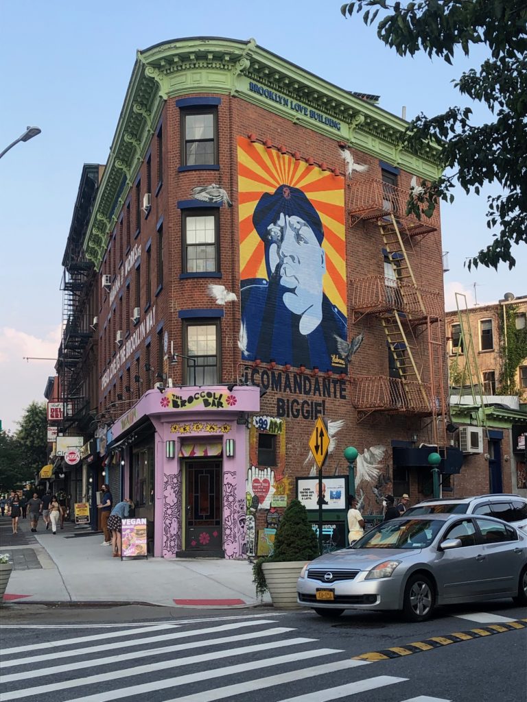 a mural of the Notorious B.I.G. on the Brooklyn Love building